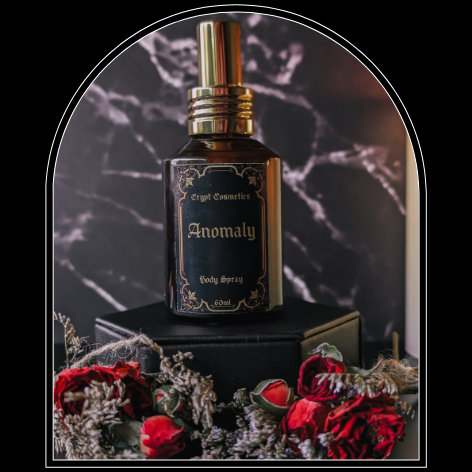Perfume bottle labeled 'Anomaly' with decorative elements on a dark background